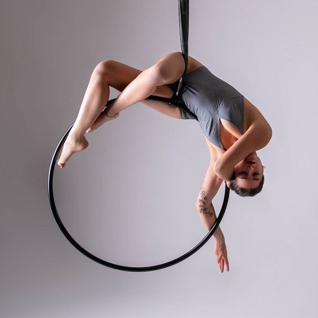 teacher nusha on aerial hoop for class at london dance academy